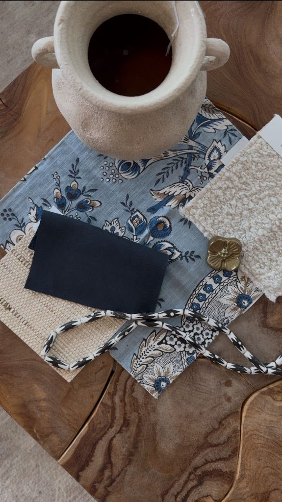 Flat lay of blue fabric swatches and cream textiles showing Details + Design's blue palette.