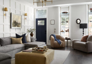 Details + Design living room featuring layered interior design with navy door, warm neutrals, and cream tones.